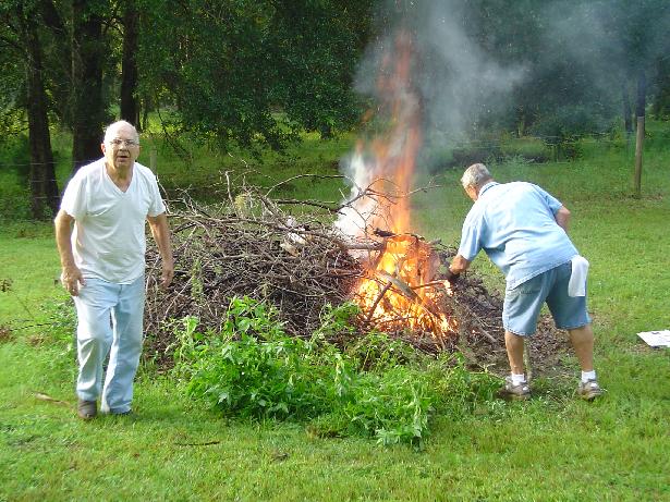 Francis and Moe tending the burn pile