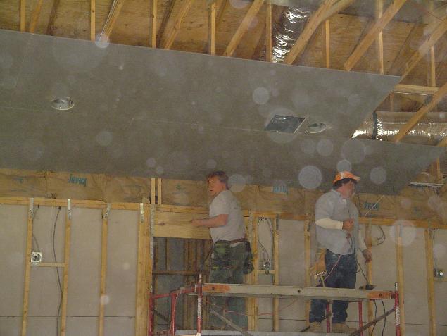 Hanging sheetrock on the ceiling