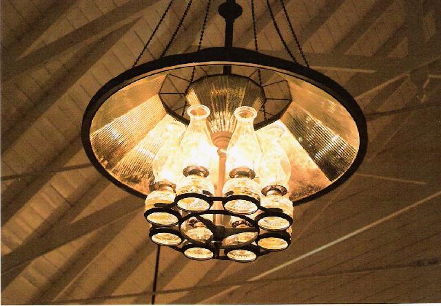 The kerosene chandelier lights the evening service