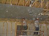 Hanging sheetrock on the ceiling