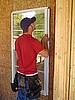 Installing the windows into the North Facade