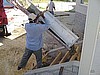 Workers pour the steps to the fellowship hall